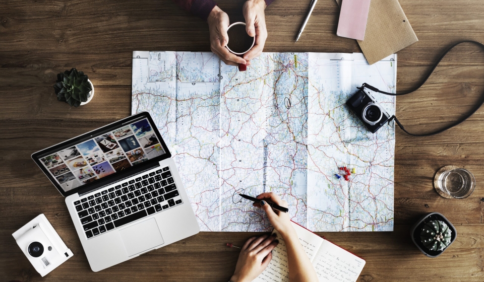 Map lying on wooden table